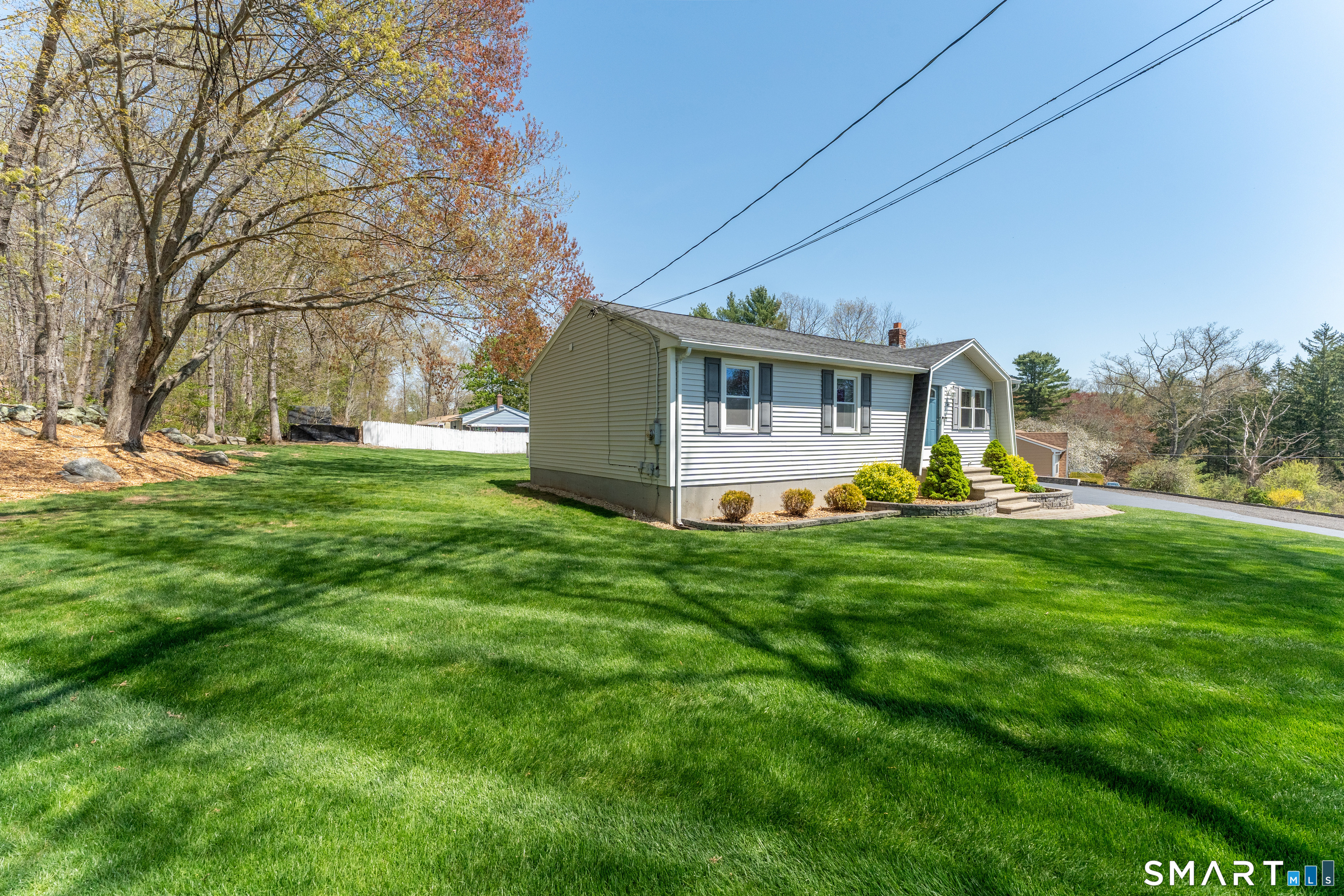 56 Thompson Hill Road Thompson, CT 06255 - Photo 2 of 38 a front view of house with yard and green space