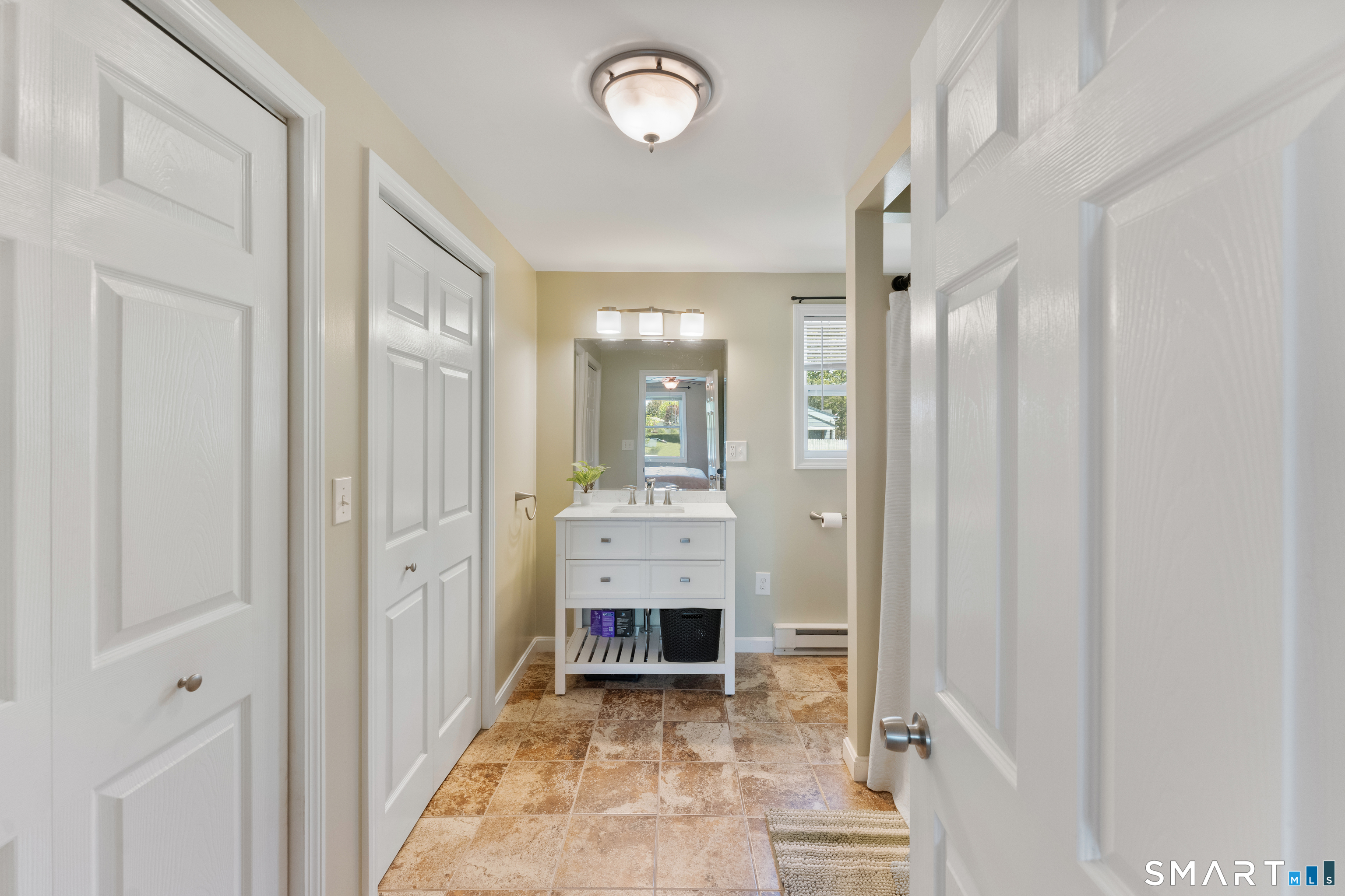 56 Thompson Hill Road Thompson, CT 06255 - Photo 22 of 38 a view of a hallway with entryway wooden floor and windows