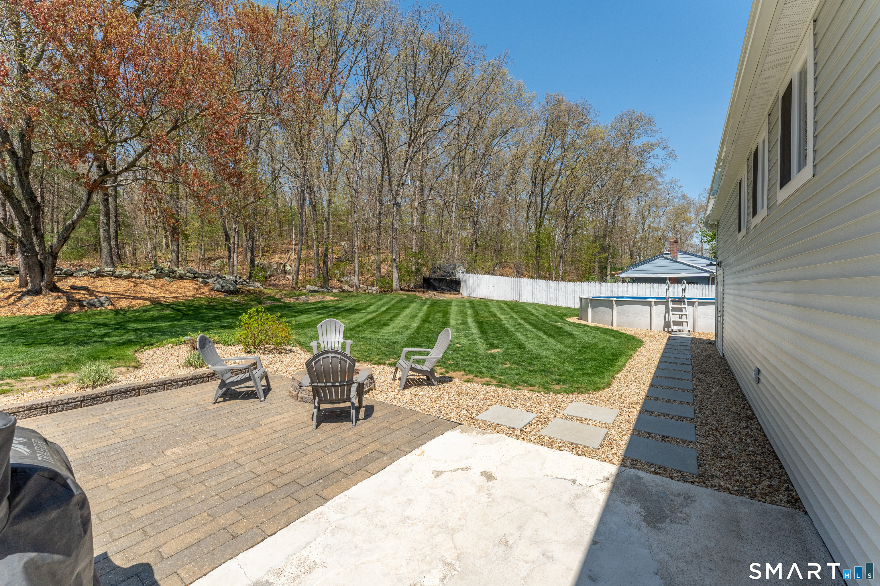 56 Thompson Hill Road Thompson, CT 06255 - Photo 34 of 38 a view of a backyard with sitting area