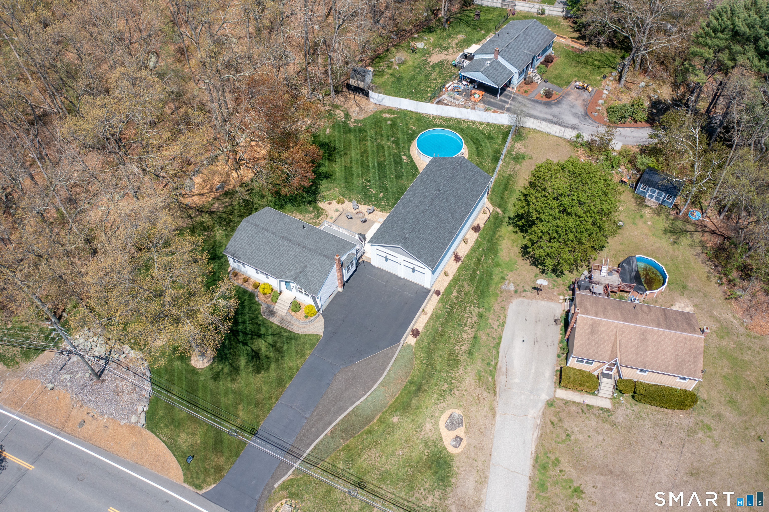 56 Thompson Hill Road Thompson, CT 06255 - Photo 37 of 38 an aerial view of a house with a garden