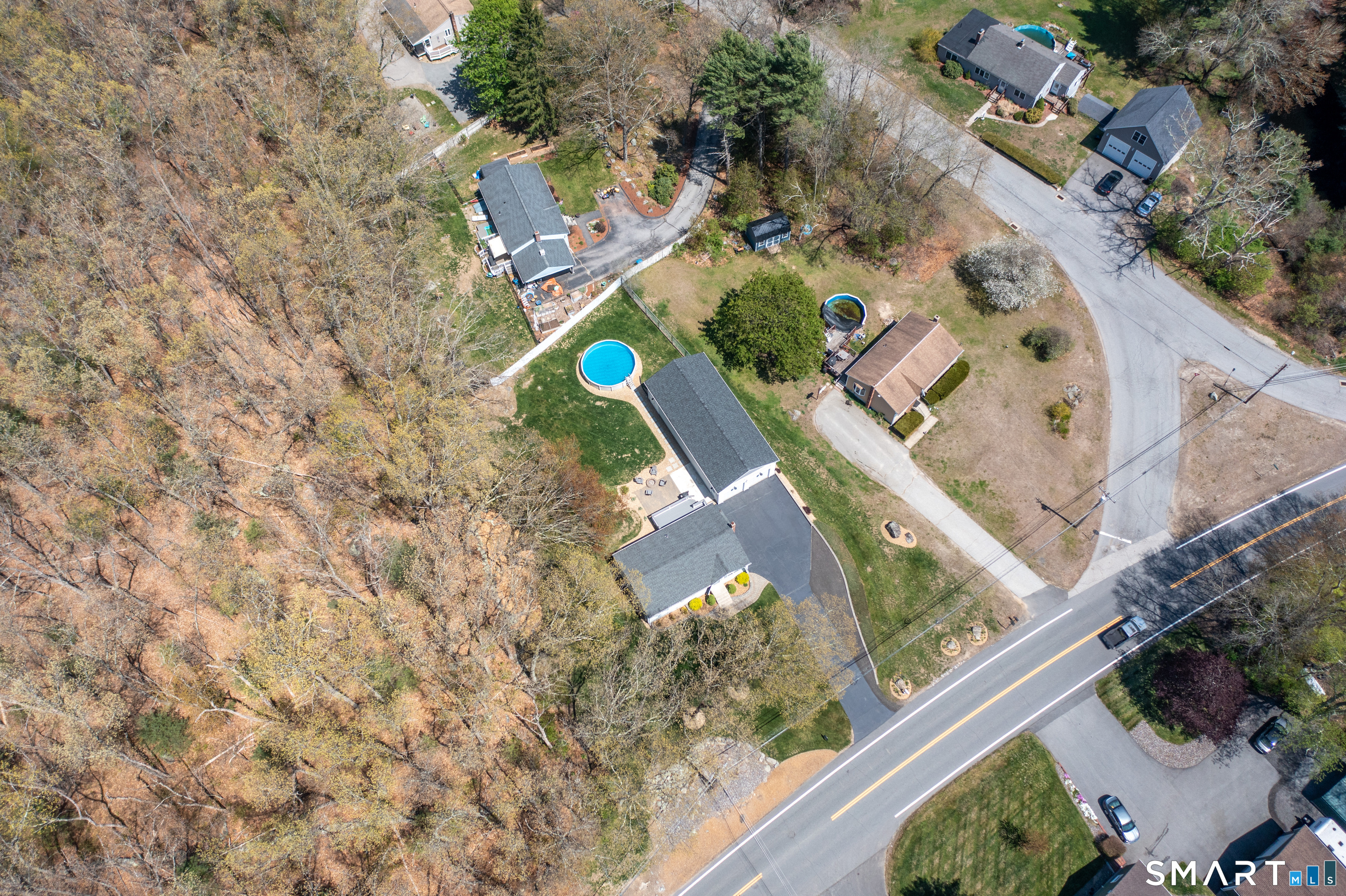 56 Thompson Hill Road Thompson, CT 06255 - Photo 38 of 38 an aerial view of a house with a yard