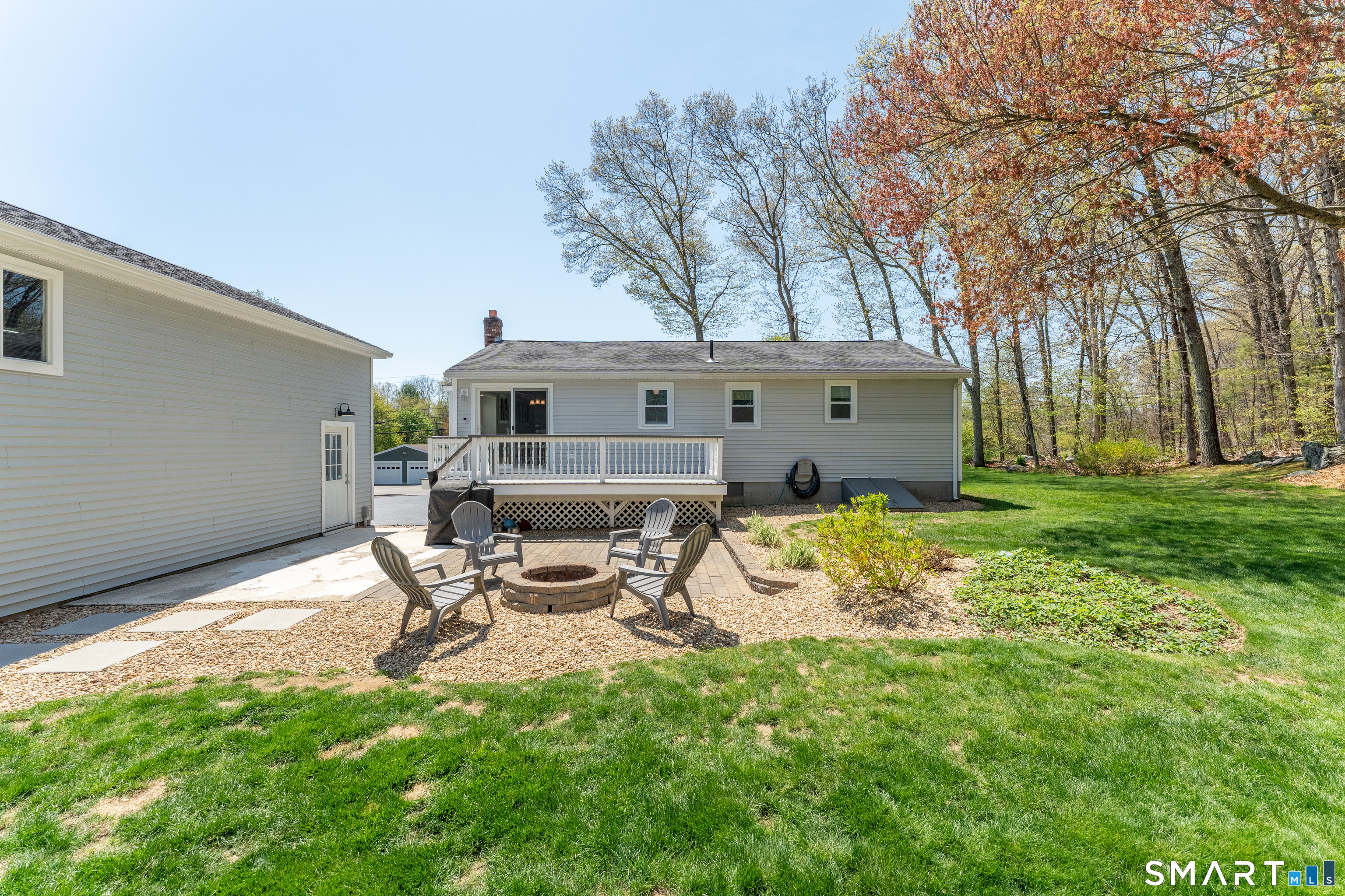 56 Thompson Hill Road Thompson, CT 06255 - Photo 6 of 38 a view of a backyard with sitting area