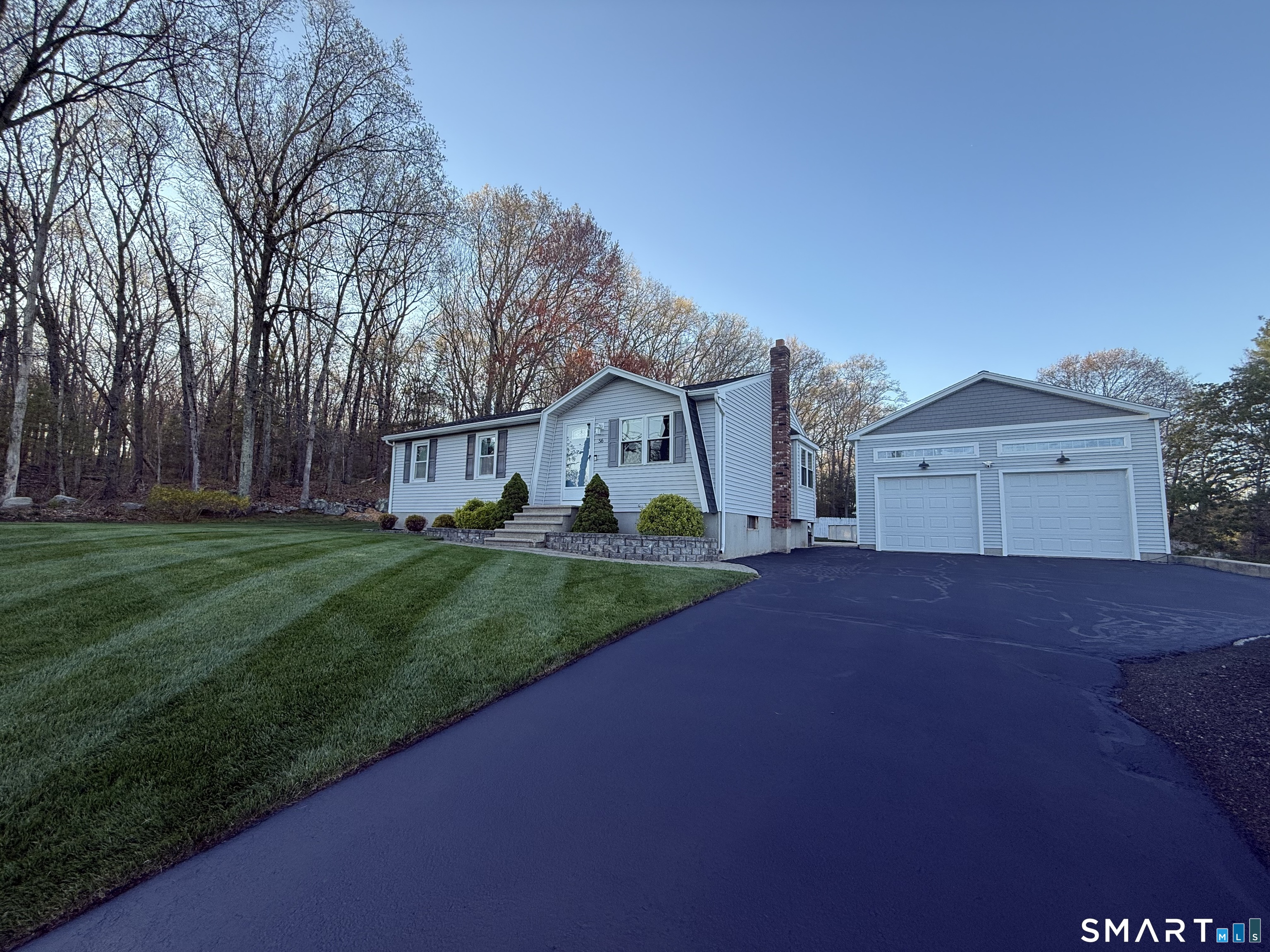 56 Thompson Hill Road Thompson, CT 06255 - Photo 8 of 38 a view of a house with a yard and garage