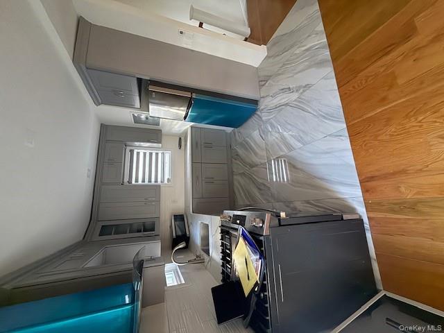 90-19 107th Avenue, Unit 2 Queens, NY 11417 - Photo 5 of 12 a kitchen with a sink appliances and cabinets