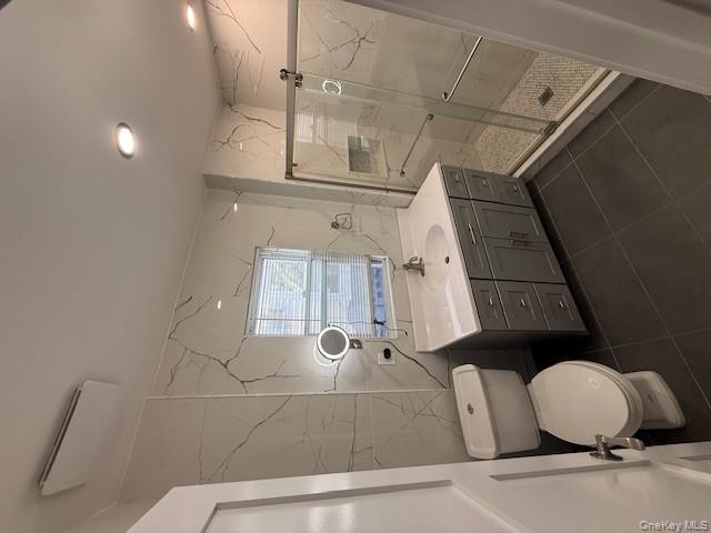 90-19 107th Avenue, Unit 2 Queens, NY 11417 - Photo 9 of 12 a bathroom with a sink toilet and shower