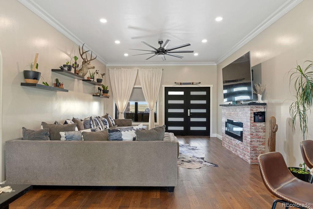 8450 Edison Road Yoder, CO 80864 - Photo 16 of 50 a living room with furniture and a flat screen tv