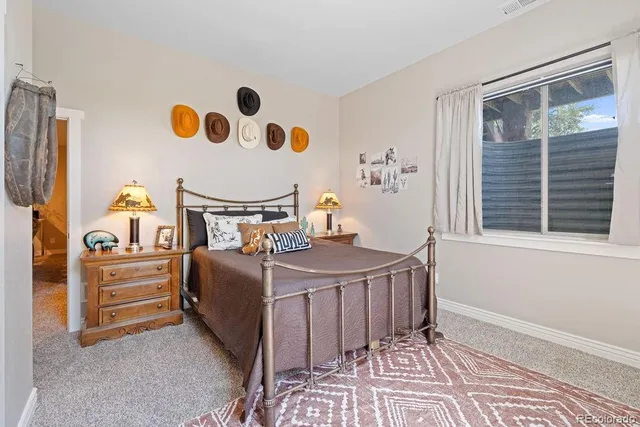 a bedroom with a bed and cabinets