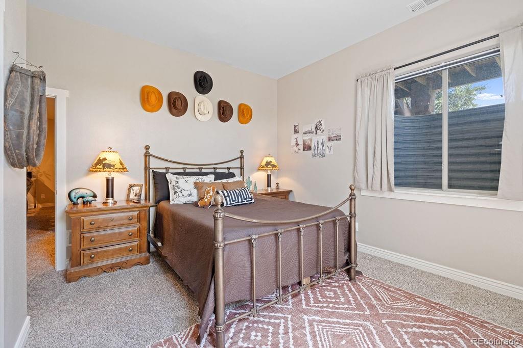 8450 Edison Road Yoder, CO 80864 - Photo 17 of 50 a bedroom with a bed and a window