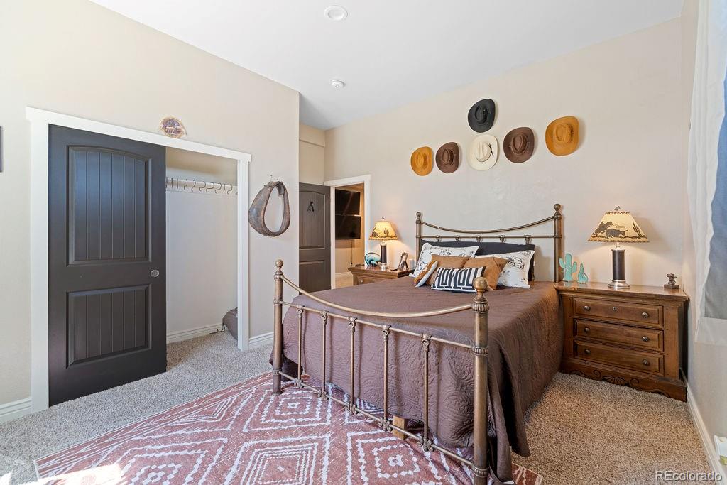 8450 Edison Road Yoder, CO 80864 - Photo 18 of 50 a bedroom with a bed and cabinets