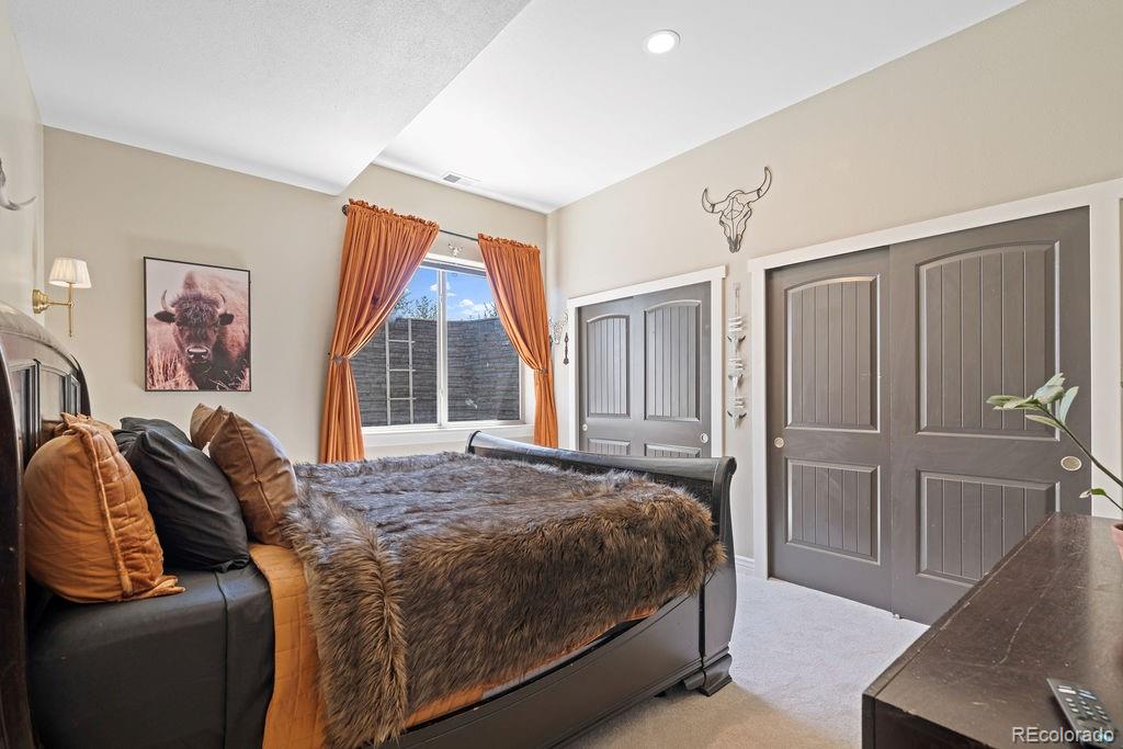 8450 Edison Road Yoder, CO 80864 - Photo 21 of 50 a bedroom with a bed and a large window