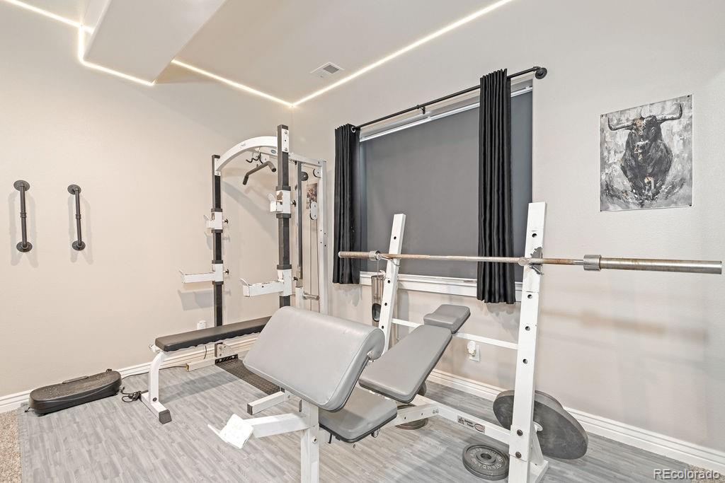 8450 Edison Road Yoder, CO 80864 - Photo 30 of 50 a living room with furniture a rug and white walls
