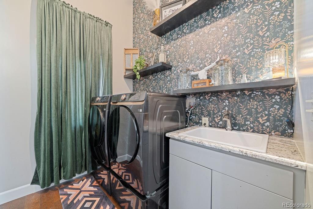 8450 Edison Road Yoder, CO 80864 - Photo 40 of 50 a bathroom with a sink a mirror and shower