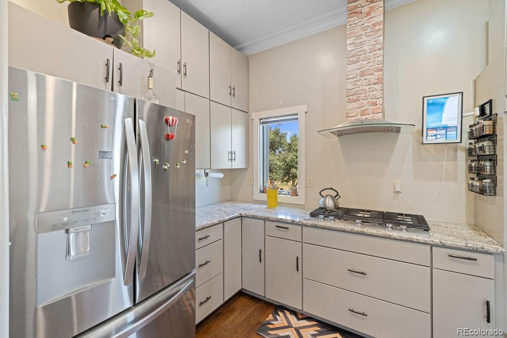 8450 Edison Road Yoder, CO 80864 - Photo 4 of 50 a kitchen with stainless steel appliances granite countertop a refrigerator and a sink