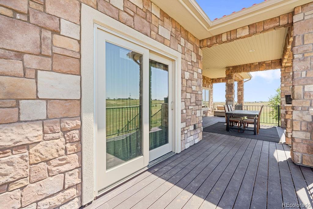 8450 Edison Road Yoder, CO 80864 - Photo 43 of 50 a view of a balcony with wooden floor