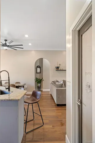 a large kitchen with a table and chairs