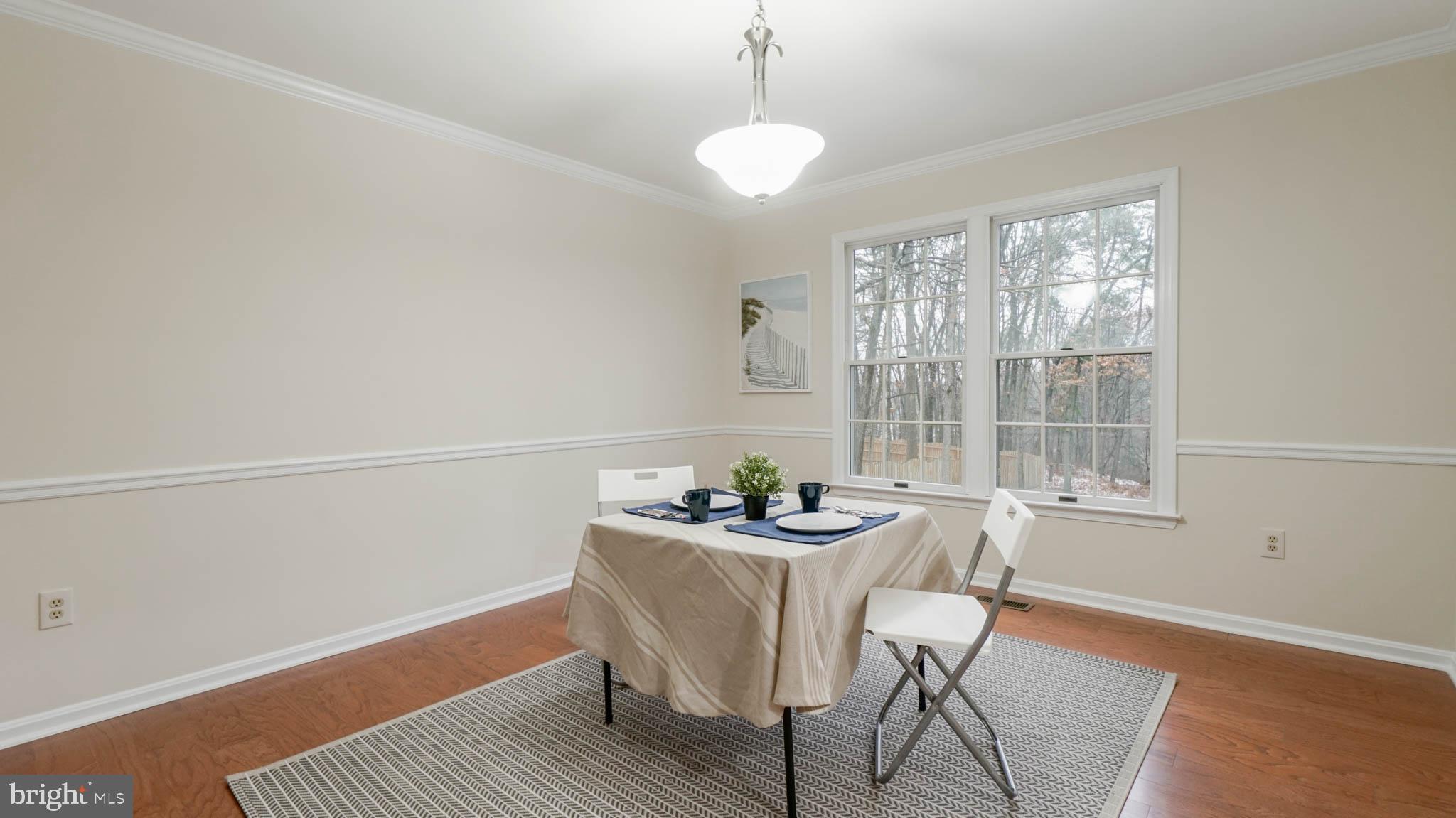 758 Fawnelm Road Severn, MD 21144 - Photo 7 of 29 Dining room with a hardwood and a woodsy view
