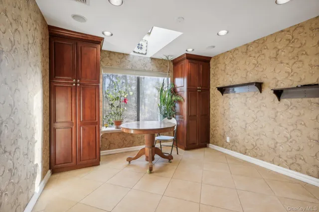 a view of a hallway with furniture and entryway