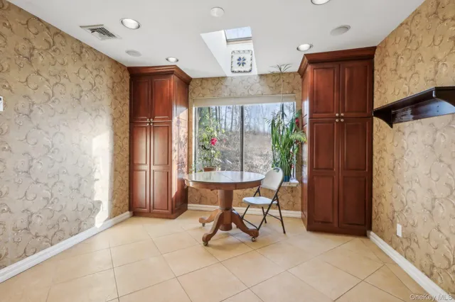 a view of a livingroom with furniture and a window