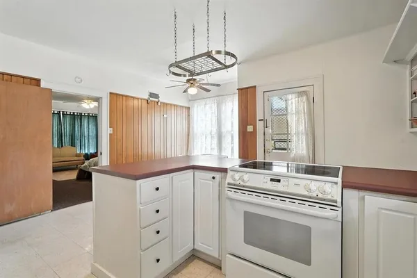a kitchen with a stove and a sink
