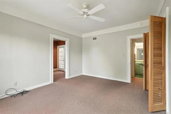 a view of a house with yard and sitting area