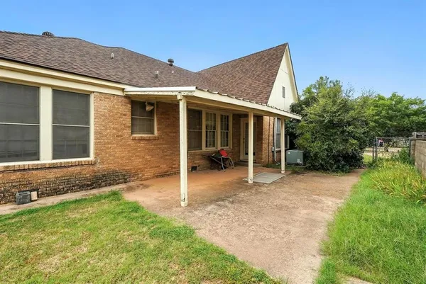 a house view with a garden space