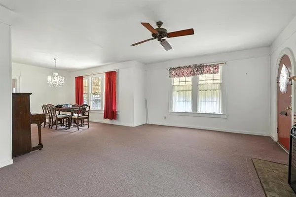 a view of a livingroom with furniture and windows