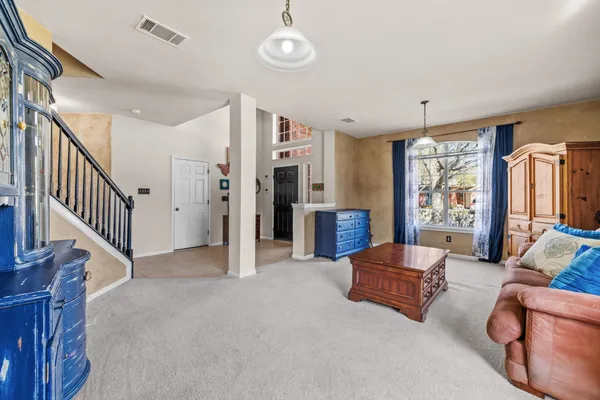 a living room with furniture and windows
