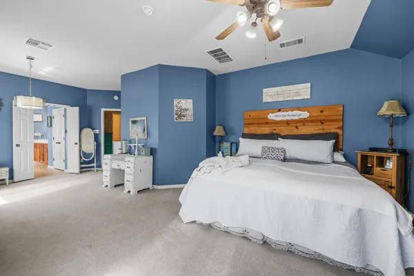 a bedroom with bed and window