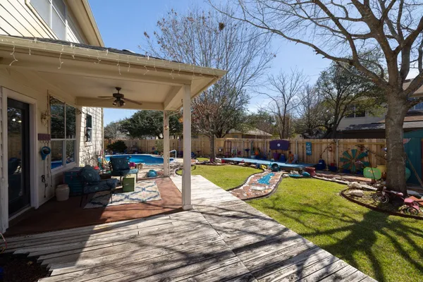 a view of a swimming pool with a patio