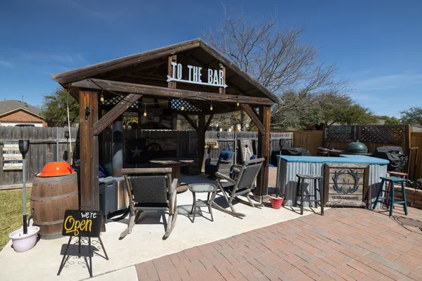 a view of a dinning tables and chairs in the patio