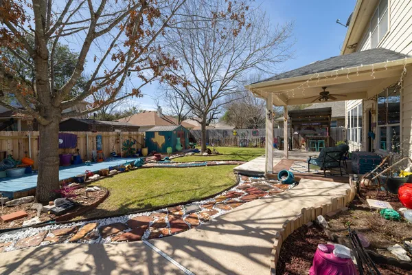a view of a house with swimming pool and sitting area