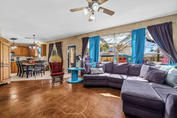 a living room with furniture and a large window