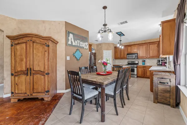 a kitchen with a sink a stove and a microwave