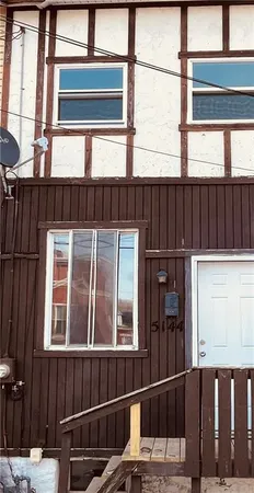 a view of balcony with two windows