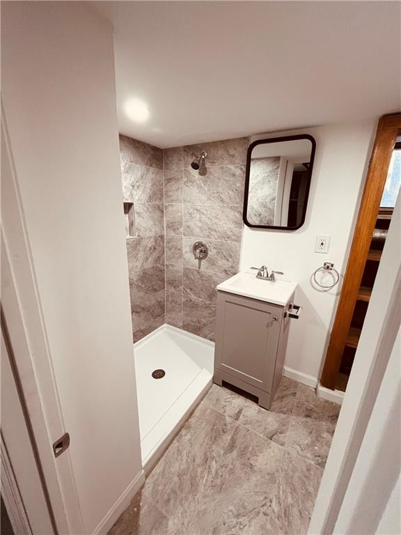 5144 Natrona Way Pittsburgh, PA 15201 - Photo 11 of 11 a bathroom with a sink a toilet and shower