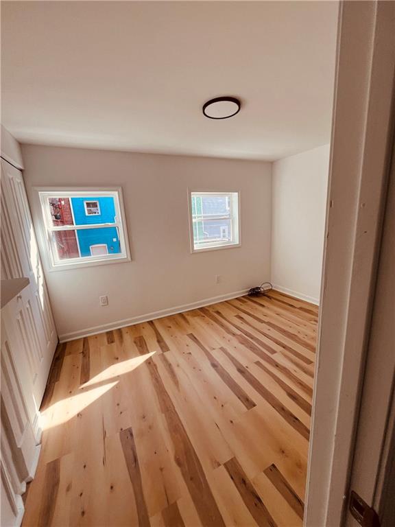 5144 Natrona Way Pittsburgh, PA 15201 - Photo 7 of 11 a view of a room with wooden floor and a window