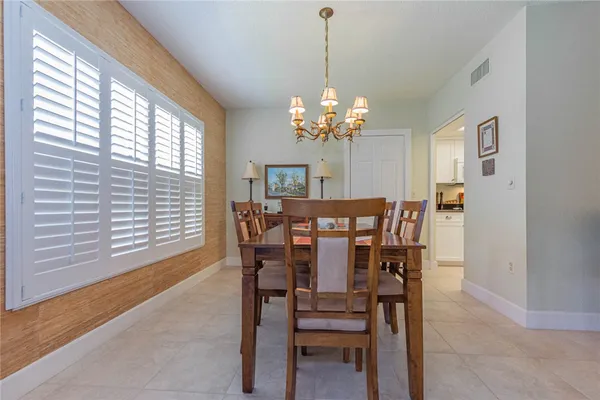 a view of a dining room with furniture and window