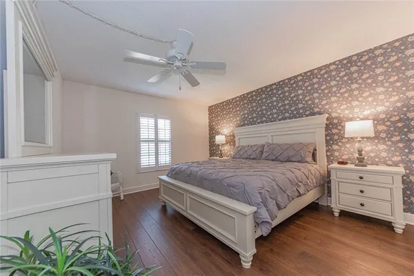 a bedroom with a bed and window
