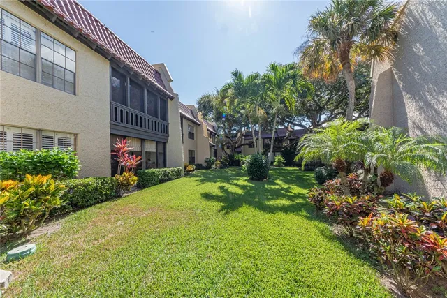 a view of a house with a yard and plants