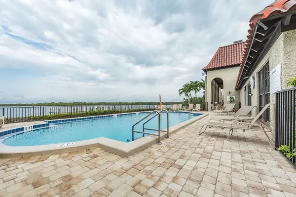 a view of a swimming pool with a terrace