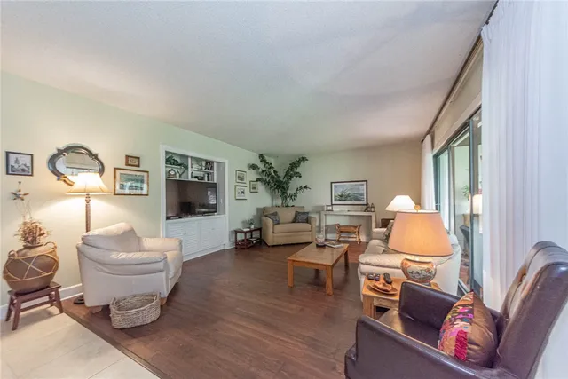 a living room with furniture and a lamp