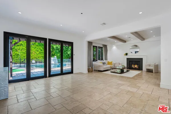a view of a livingroom with furniture and a fireplace