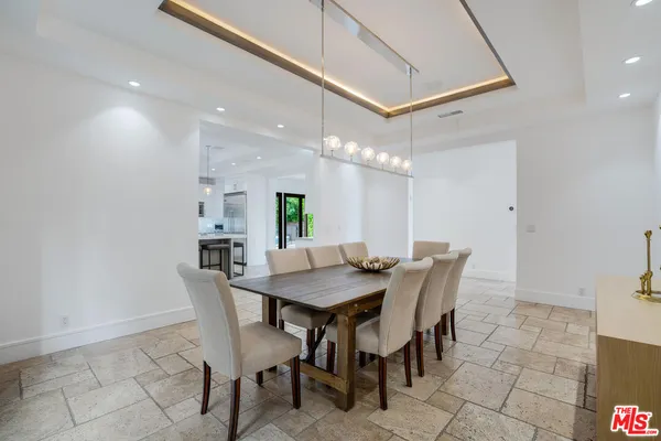 a view of a dining room and livingroom with furniture