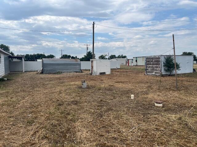 3811 Lakeview Road Hereford, TX 79045 - Photo 12 of 12 a view of a dry yard with wooden fence
