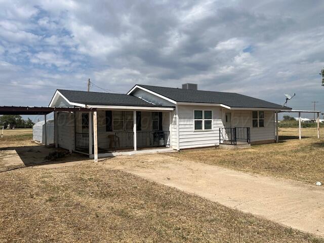 3811 Lakeview Road Hereford, TX 79045 - Photo 2 of 12 a front view of a house with a yard and garage