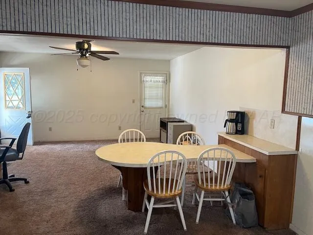 a view of a dining room with furniture