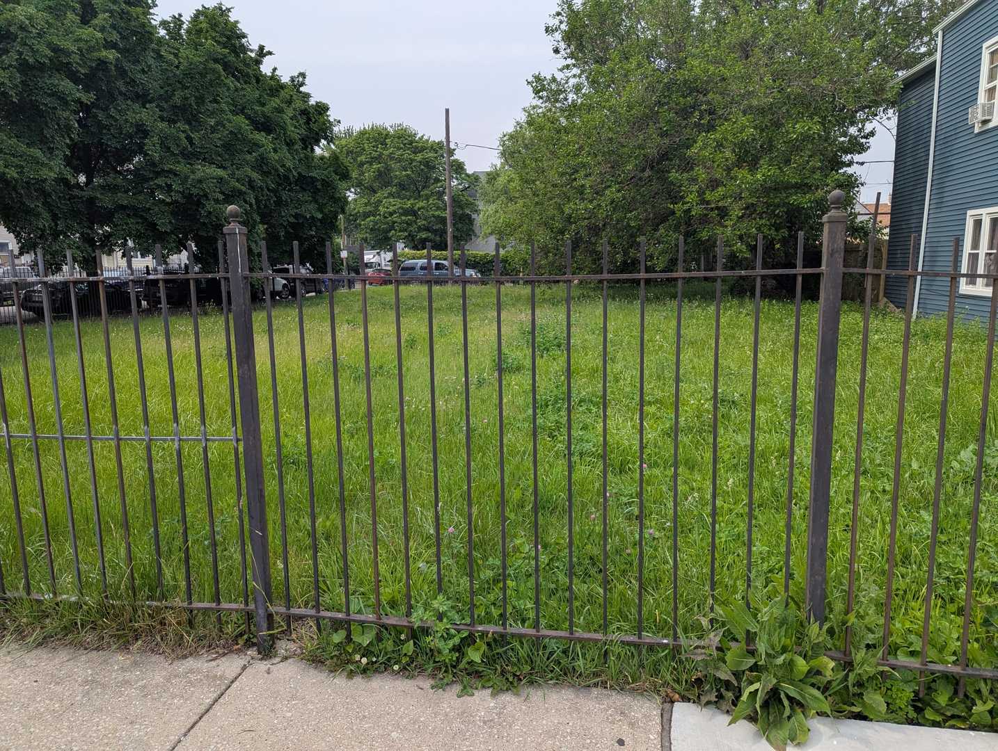 1756 West 48th Street Chicago, IL 60609 - Photo 5 of 12 a view of a swimming pool with a bench and trees around