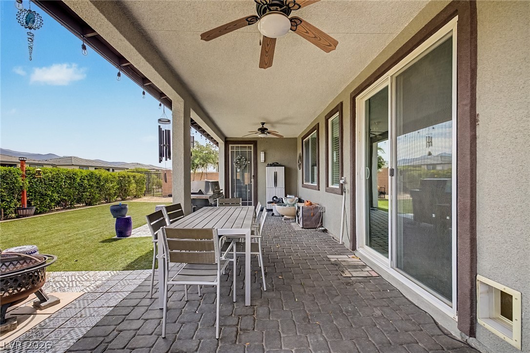 4914 East Beacon Ridge Drive Pahrump, NV 89061 - Photo 26 of 34 An inviting covered patio offers ample space for outdoor dining and relaxation with direct yard access.