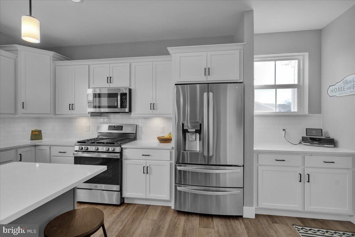 1057 Ryebrook Road Reading, PA 19608 - Photo 11 of 49 a kitchen with white cabinets and stainless steel appliances