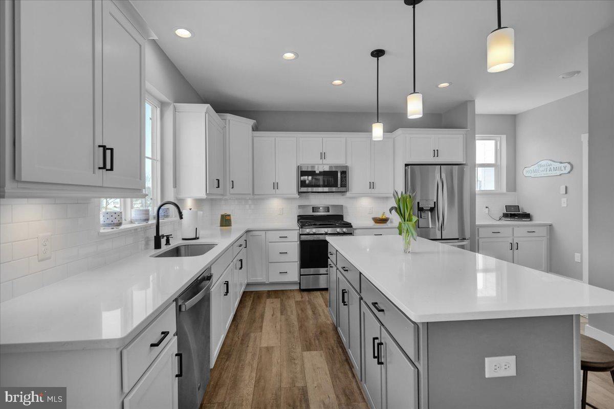 1057 Ryebrook Road Reading, PA 19608 - Photo 12 of 49 a kitchen with kitchen island a white counter top space cabinets and stainless steel appliances